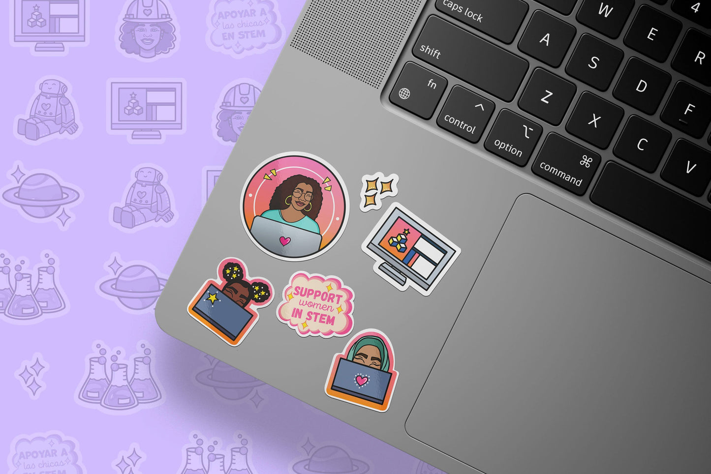 Laptop with stickers on a purple background with icons
