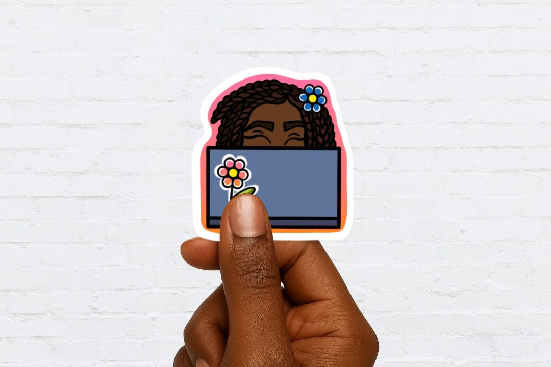 Sticker of a black woman behind a computer screen with flowers held by a hand against a white brick wall background