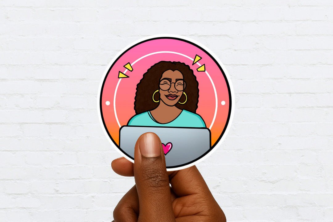 Hand holding a sticker of a woman behind a laptop screen on a white brick wall background