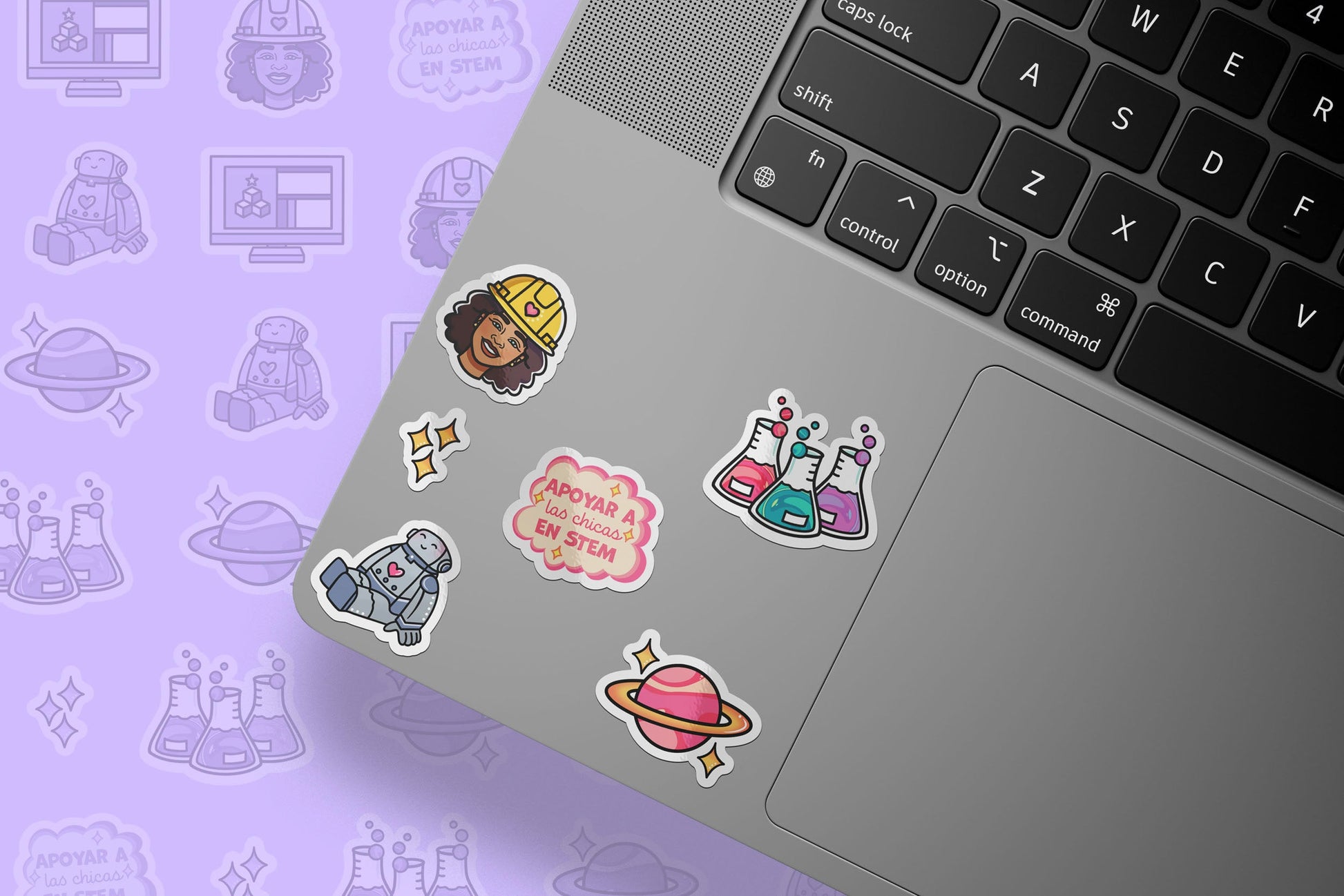 Laptop with stickers on a purple background with science-themed icons